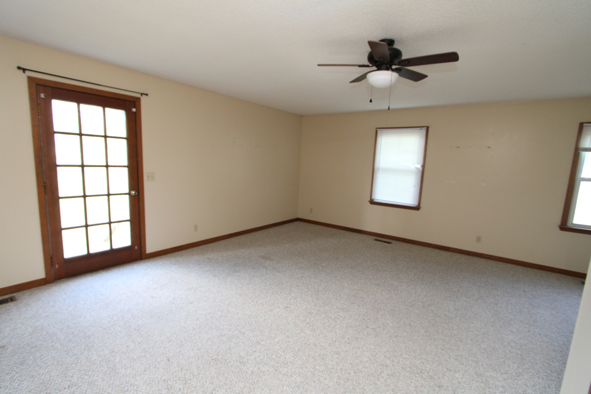 680 Oak Grove Road Goodspring, TN 38460 - Photo 15 of 25 a view of a livingroom with a ceiling fan and window