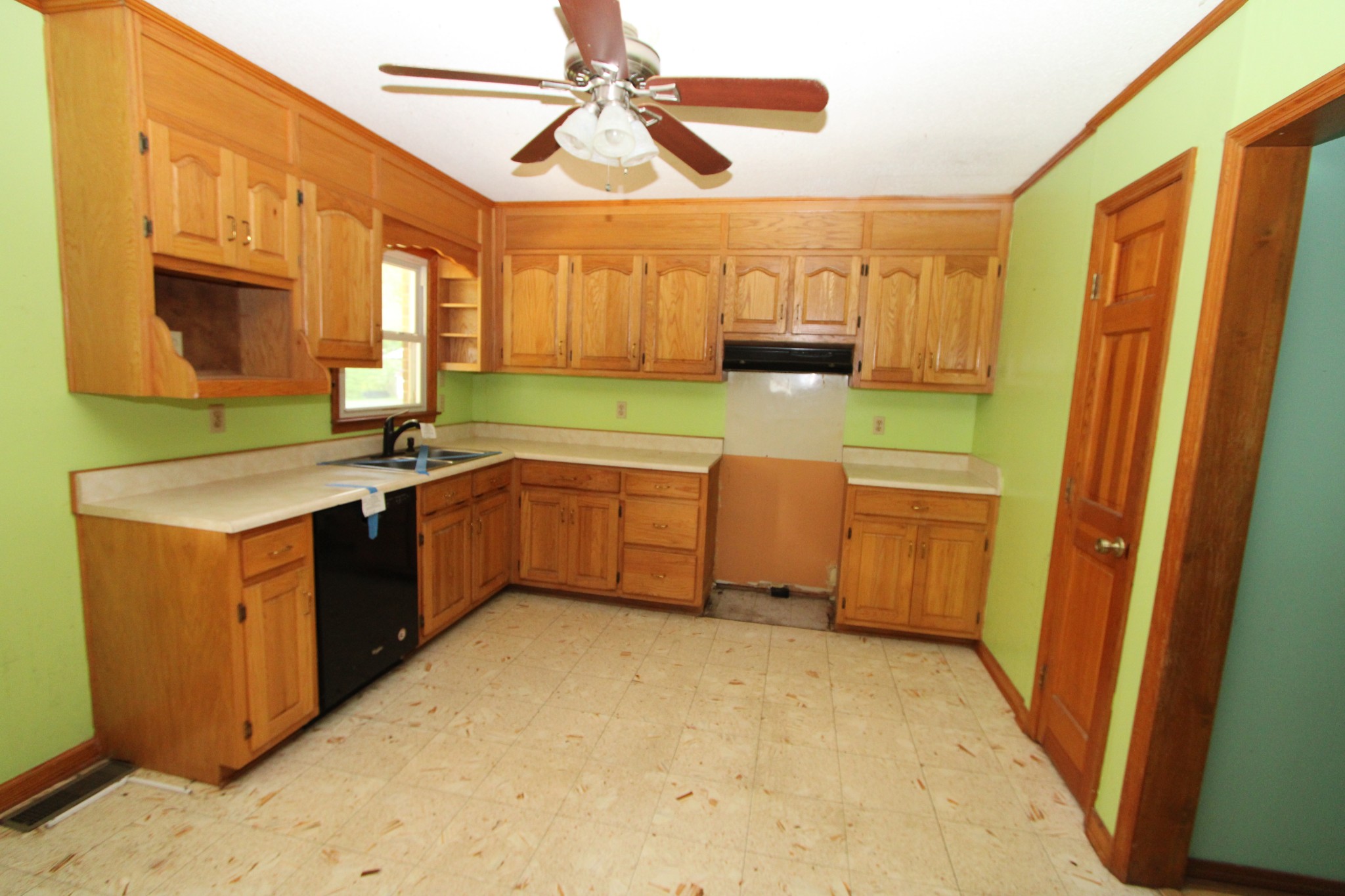 680 Oak Grove Road Goodspring, TN 38460 - Photo 23 of 25 a kitchen with a sink a stove top oven a window
