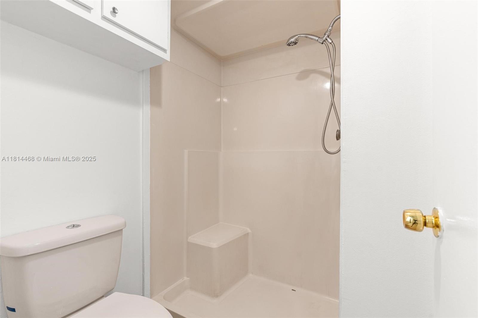 15007 Coconut Court Miami Lakes, FL 33014 - Photo 18 of 27 a bathroom with a shower a toilet and a shower