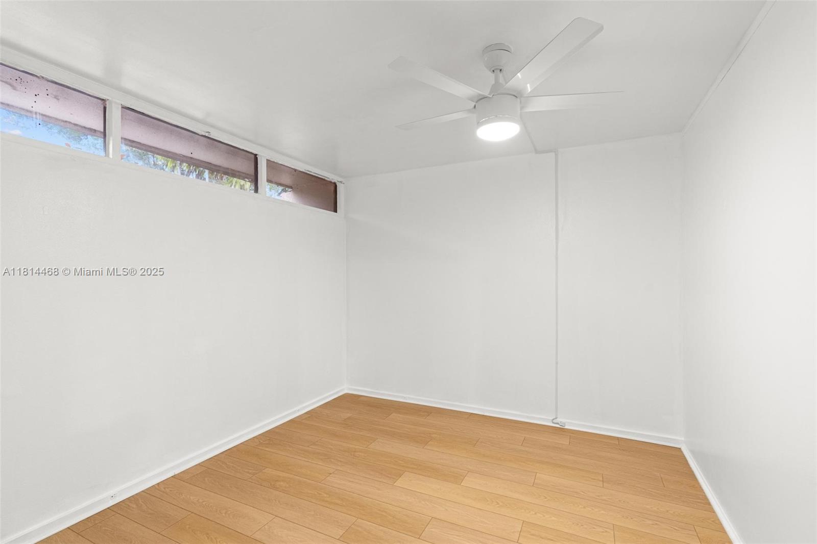 15007 Coconut Court Miami Lakes, FL 33014 - Photo 19 of 27 a view of an empty room with a window