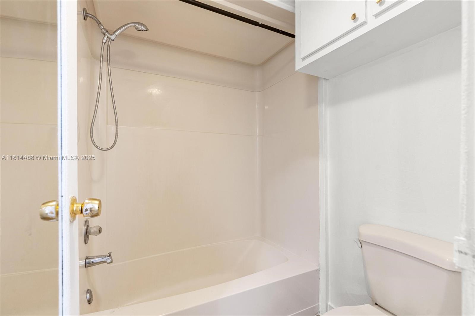 15007 Coconut Court Miami Lakes, FL 33014 - Photo 21 of 27 a bathroom with a bath tub with a shower