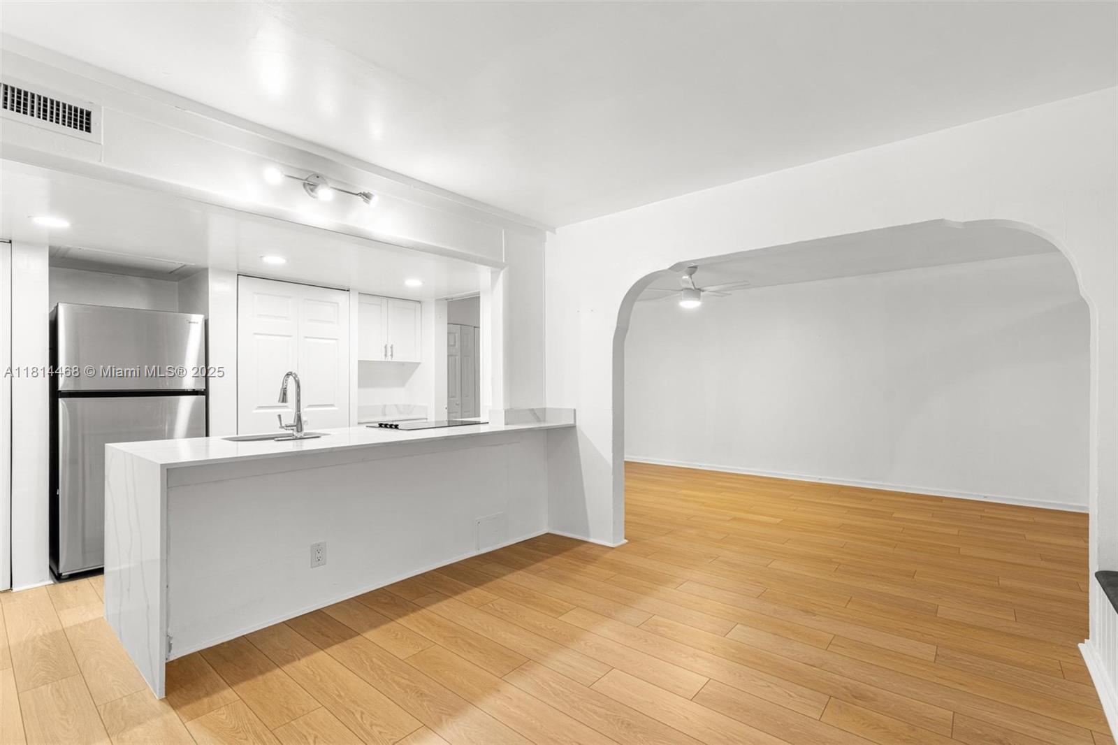 15007 Coconut Court Miami Lakes, FL 33014 - Photo 6 of 27 a view of kitchen with stainless steel appliances cabinets and wooden floor