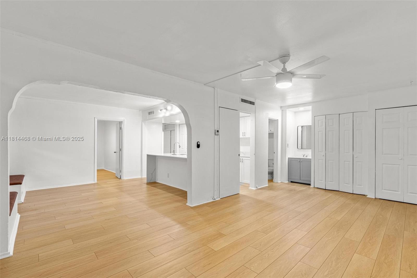 15007 Coconut Court Miami Lakes, FL 33014 - Photo 10 of 27 a view of a livingroom with a chandelier fan and wooden floor