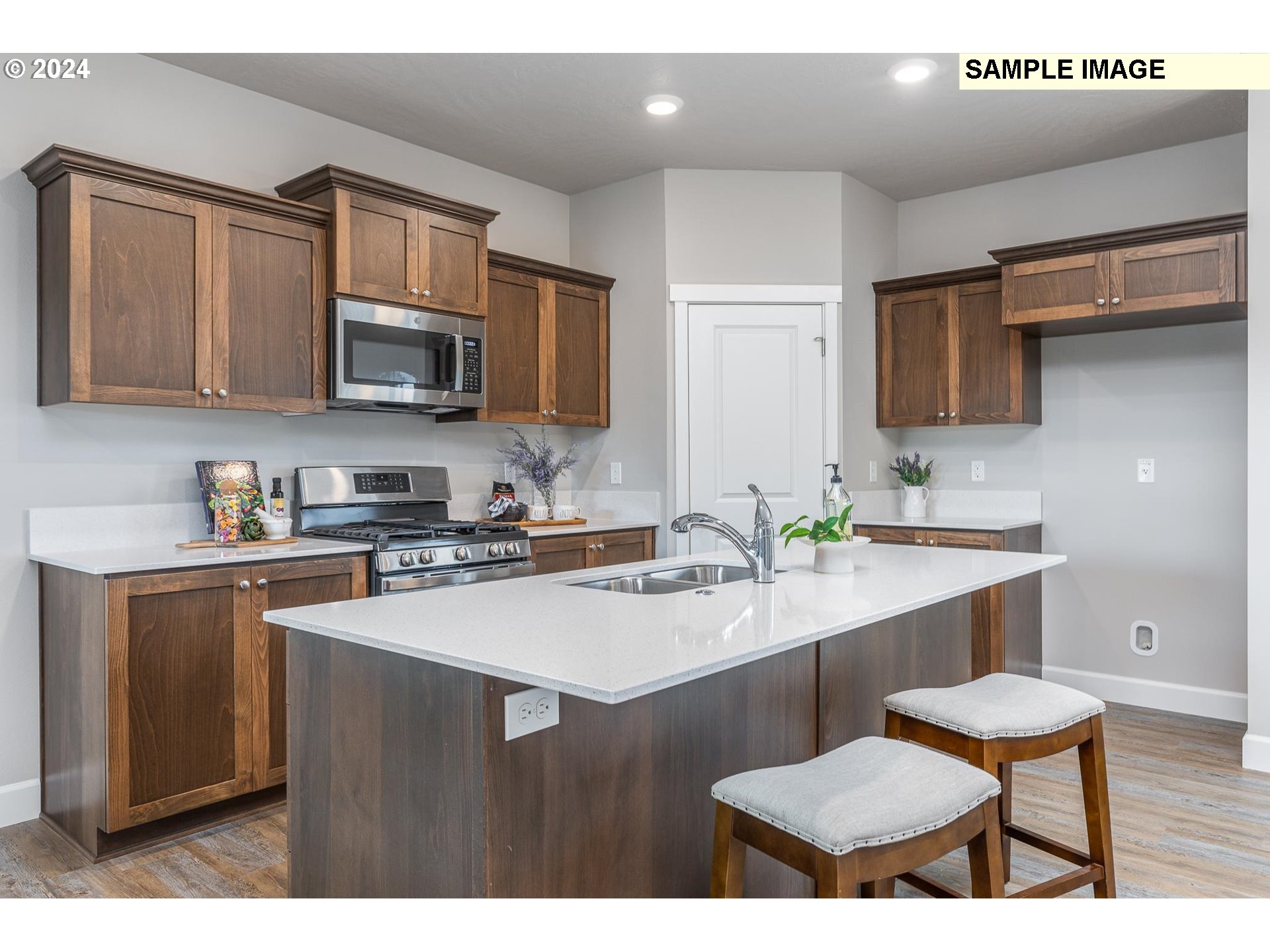 1734 Northeast 9th Street Hermiston, OR 97838 - Photo 11 of 31 a kitchen with a sink cabinets and wooden floor