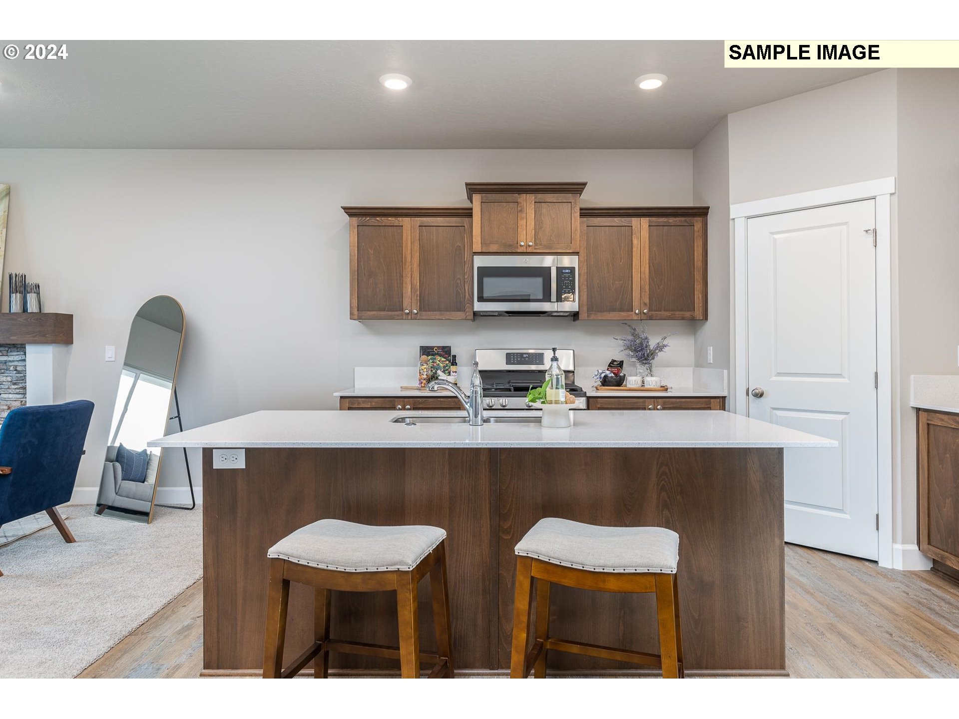 1734 Northeast 9th Street Hermiston, OR 97838 - Photo 12 of 31 a kitchen with stainless steel appliances a sink stove and cabinets