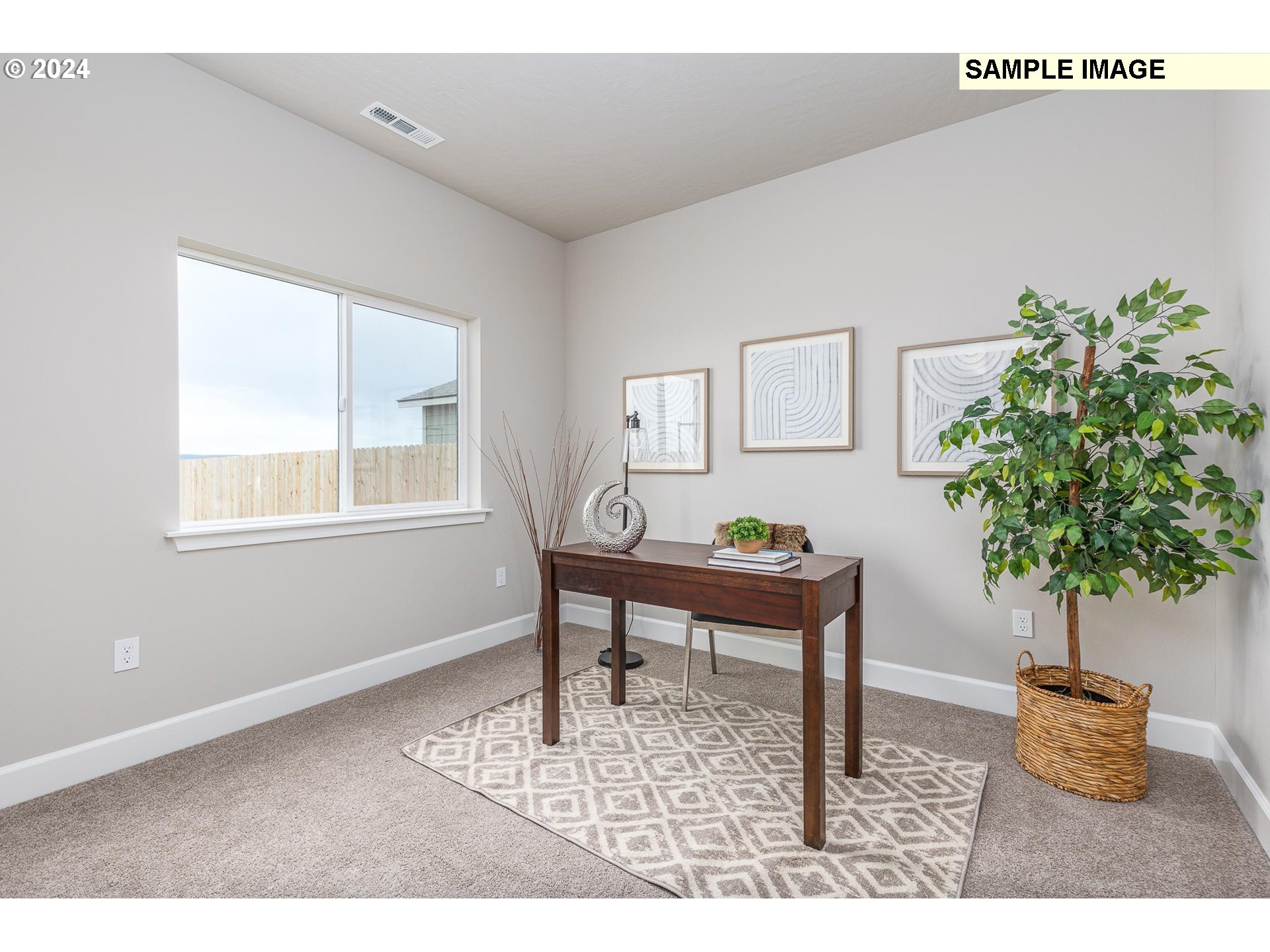 1734 Northeast 9th Street Hermiston, OR 97838 - Photo 13 of 31 a living room with furniture and a potted plant