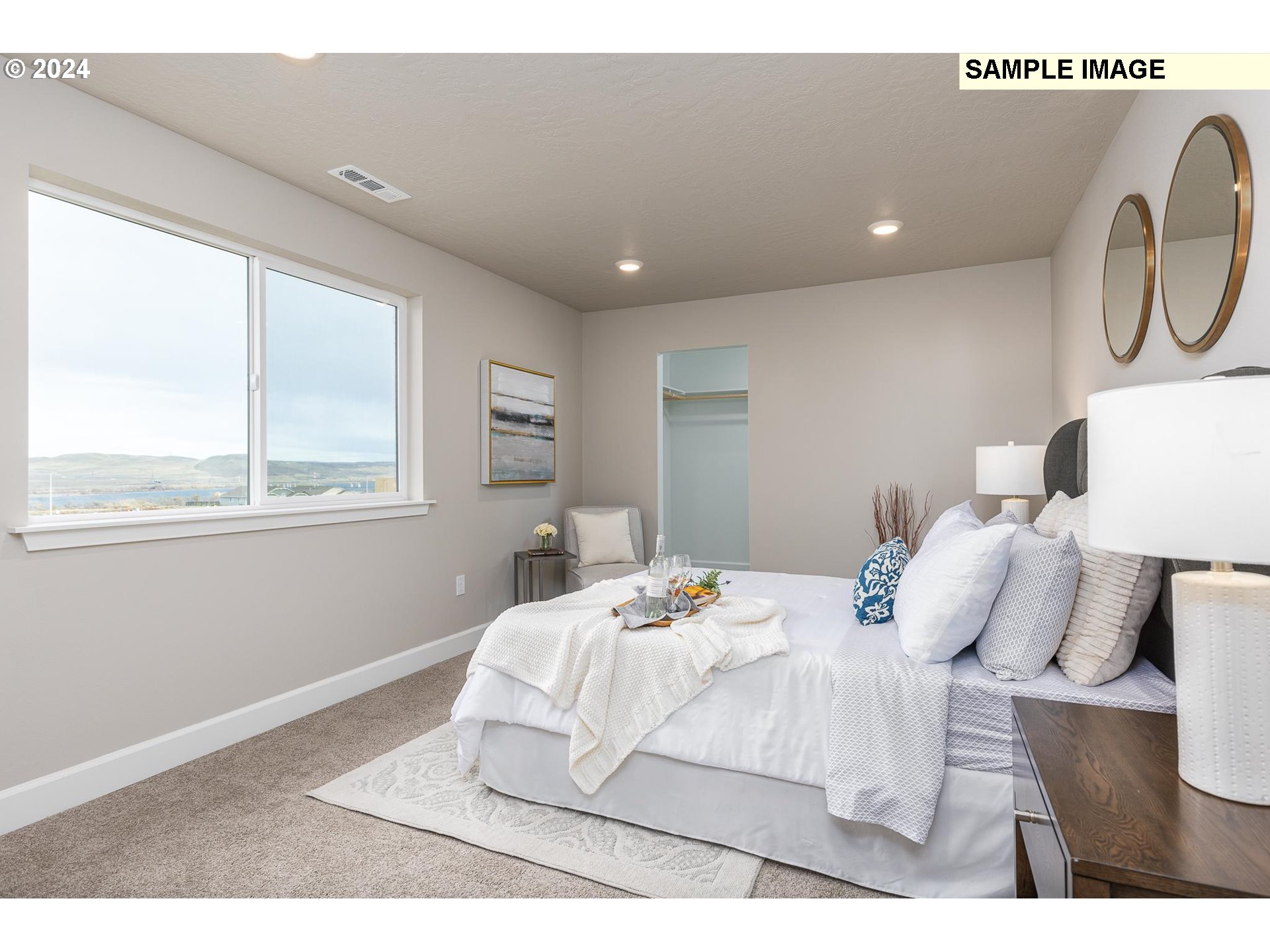 1734 Northeast 9th Street Hermiston, OR 97838 - Photo 17 of 31 a bedroom with a bed and a window