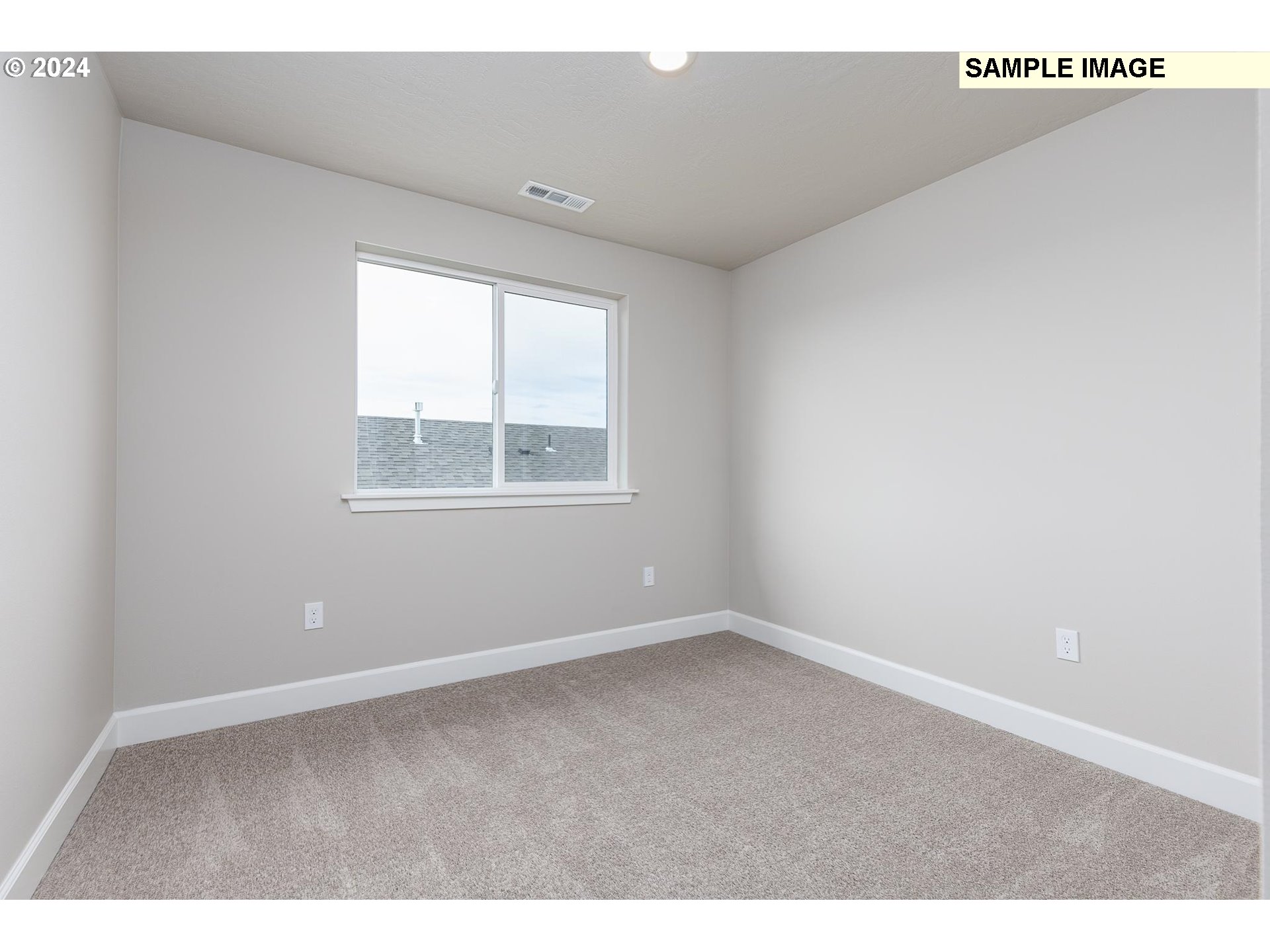 1734 Northeast 9th Street Hermiston, OR 97838 - Photo 21 of 31 an empty room with wooden floor and windows