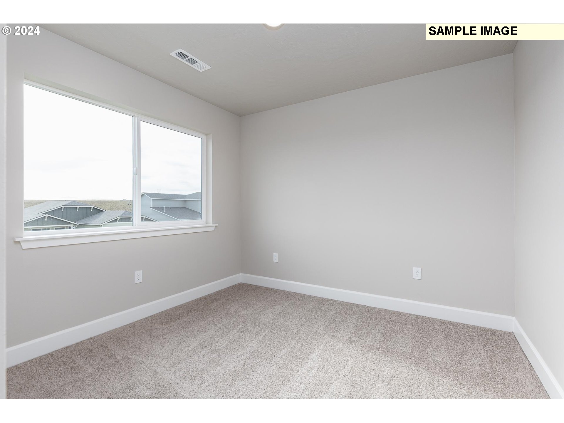 1734 Northeast 9th Street Hermiston, OR 97838 - Photo 22 of 31 a view of an empty room with a window
