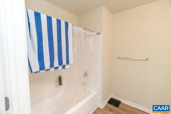 a view of a yard with large trees