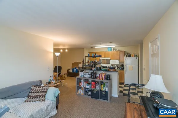 a living room with furniture fireplace and window