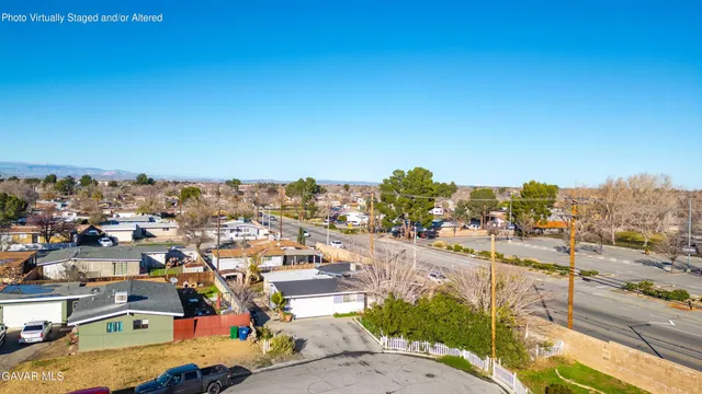 a bedroom with furniture a chimney and a chandelier