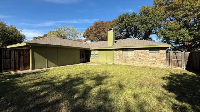 a house with trees in the background