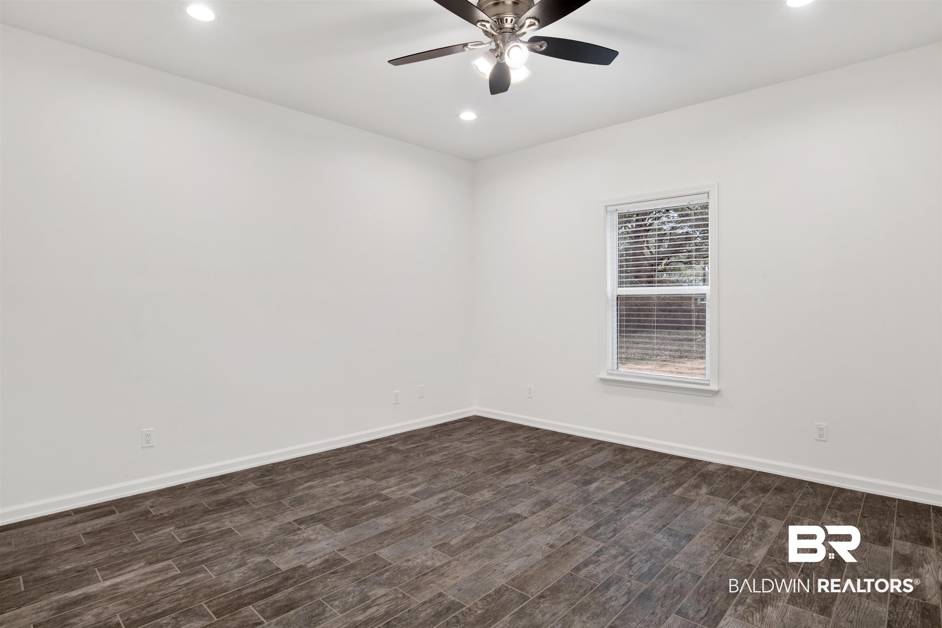 10871 Somerset Road Grand Bay, AL 36541 - Photo 20 of 31 Unfurnished room featuring dark wood-type flooring and ceiling fan