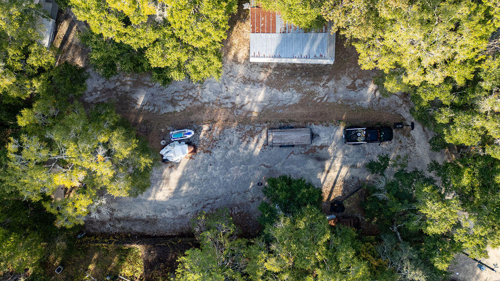 78 April Court Freeport, FL 32439 - Photo 18 of 18 a view of a wooden house with a tree