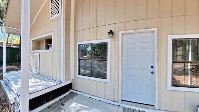 a kitchen with a refrigerator and a sink