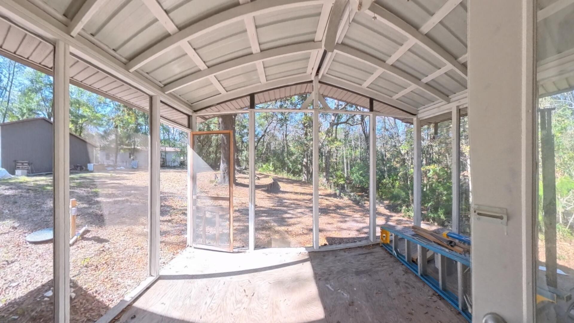 78 April Court Freeport, FL 32439 - Photo 33 of 39 a view of porch with a floor to ceiling window and an outdoor space