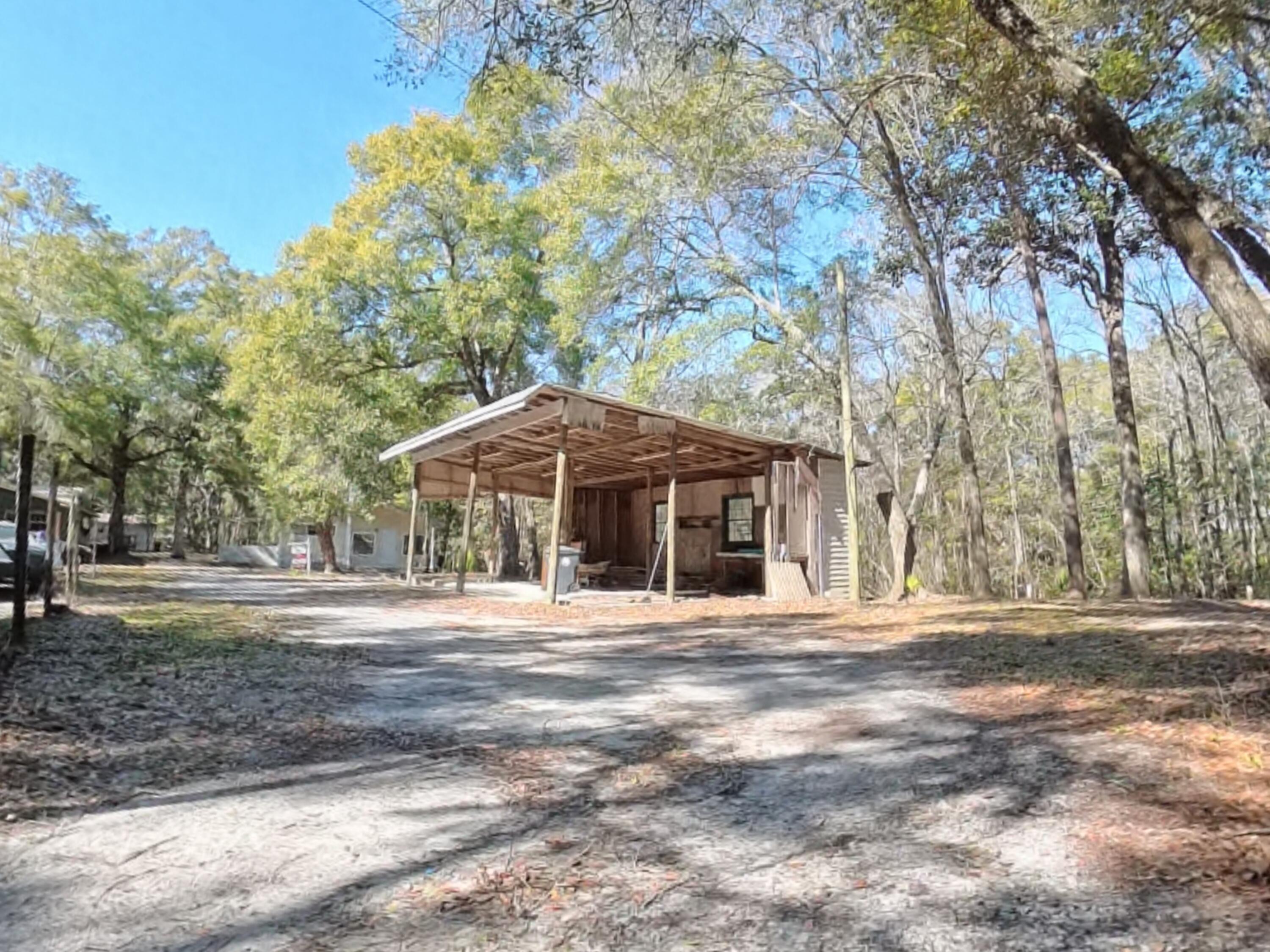 78 April Court Freeport, FL 32439 - Photo 36 of 39 a front view of a house with a yard