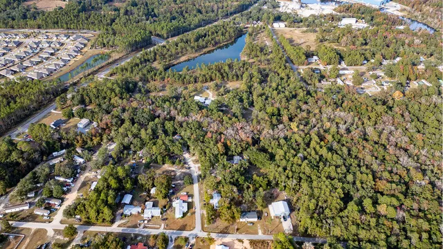 an aerial view of residential houses with outdoor space