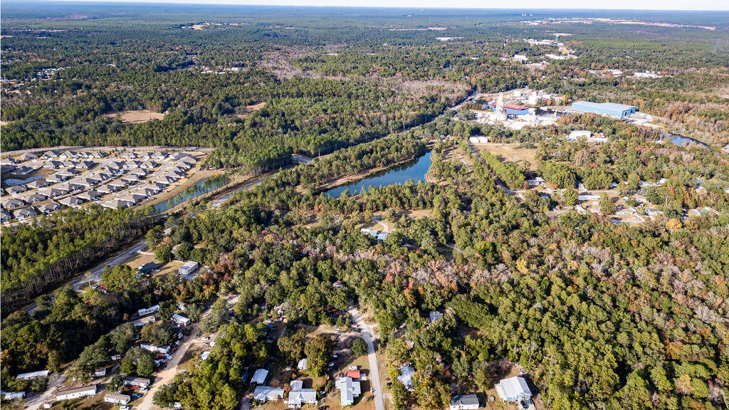 78 April Court Freeport, FL 32439 - Photo 10 of 18 an aerial view of residential houses with city view