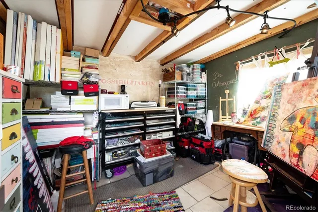 a view of a backyard with a small cabin and wooden fence