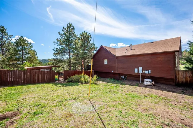 a view of barn with wooden fence
