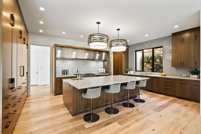 a bathroom with a sink a vanity and a mirror