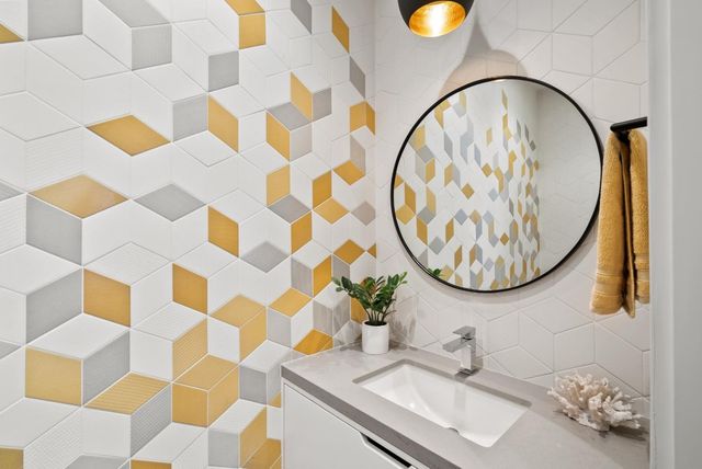 a spacious bathroom with a granite countertop tub sink and mirror