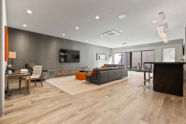 a bedroom with bed and a window