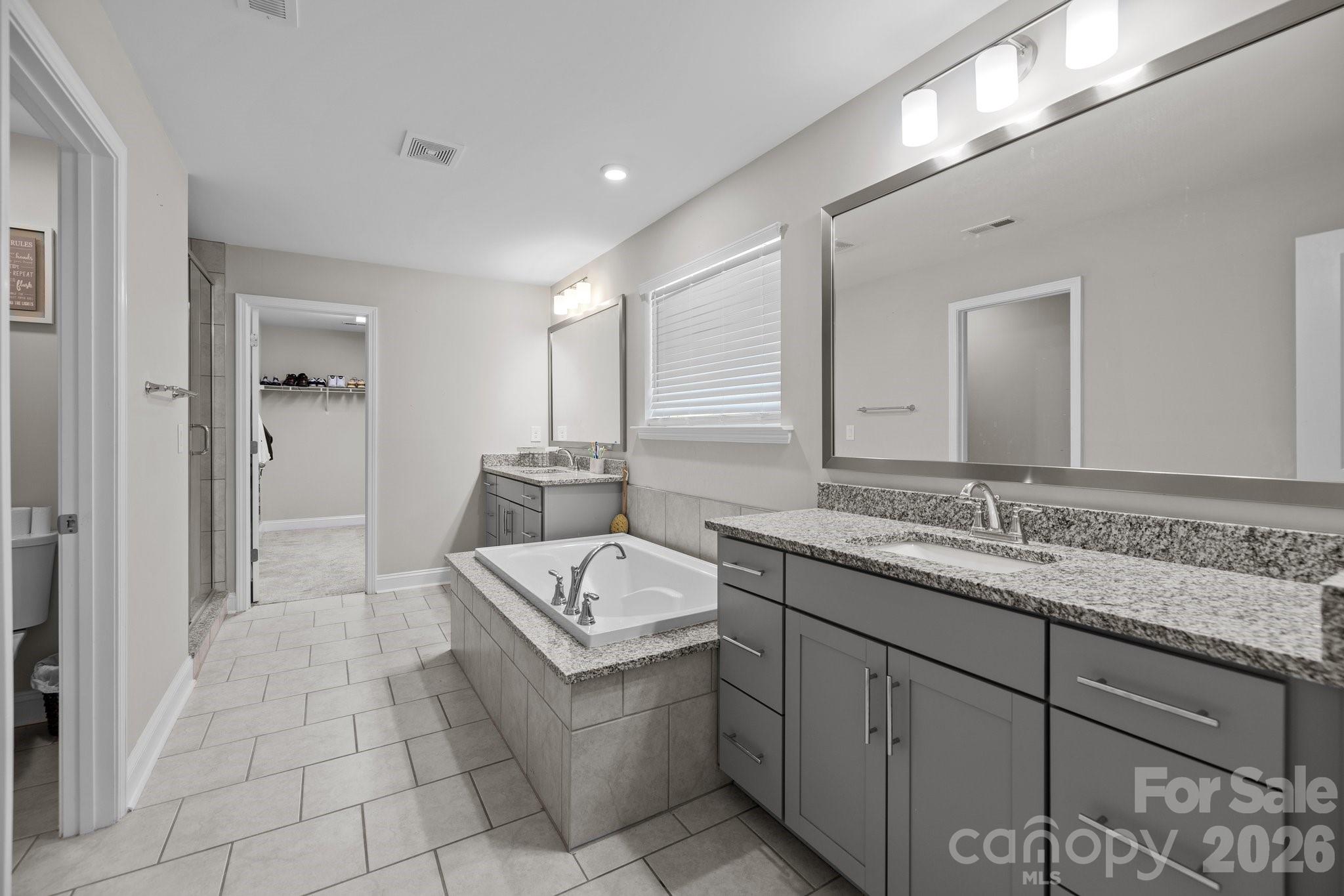 241 Boxelder Road Clover, SC 29710 - Photo 19 of 35 a bathroom with a tub sink and mirror