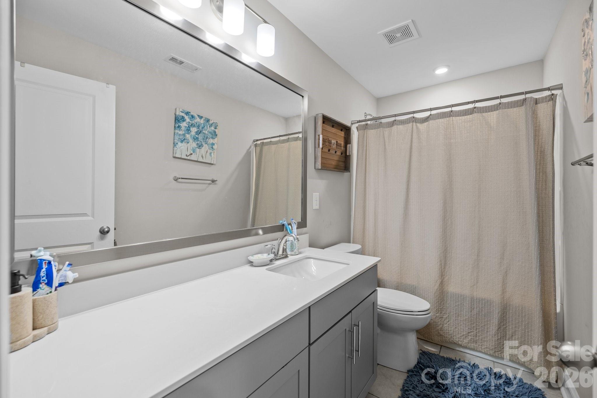 241 Boxelder Road Clover, SC 29710 - Photo 25 of 35 a bathroom with a sink mirror vanity and toilet