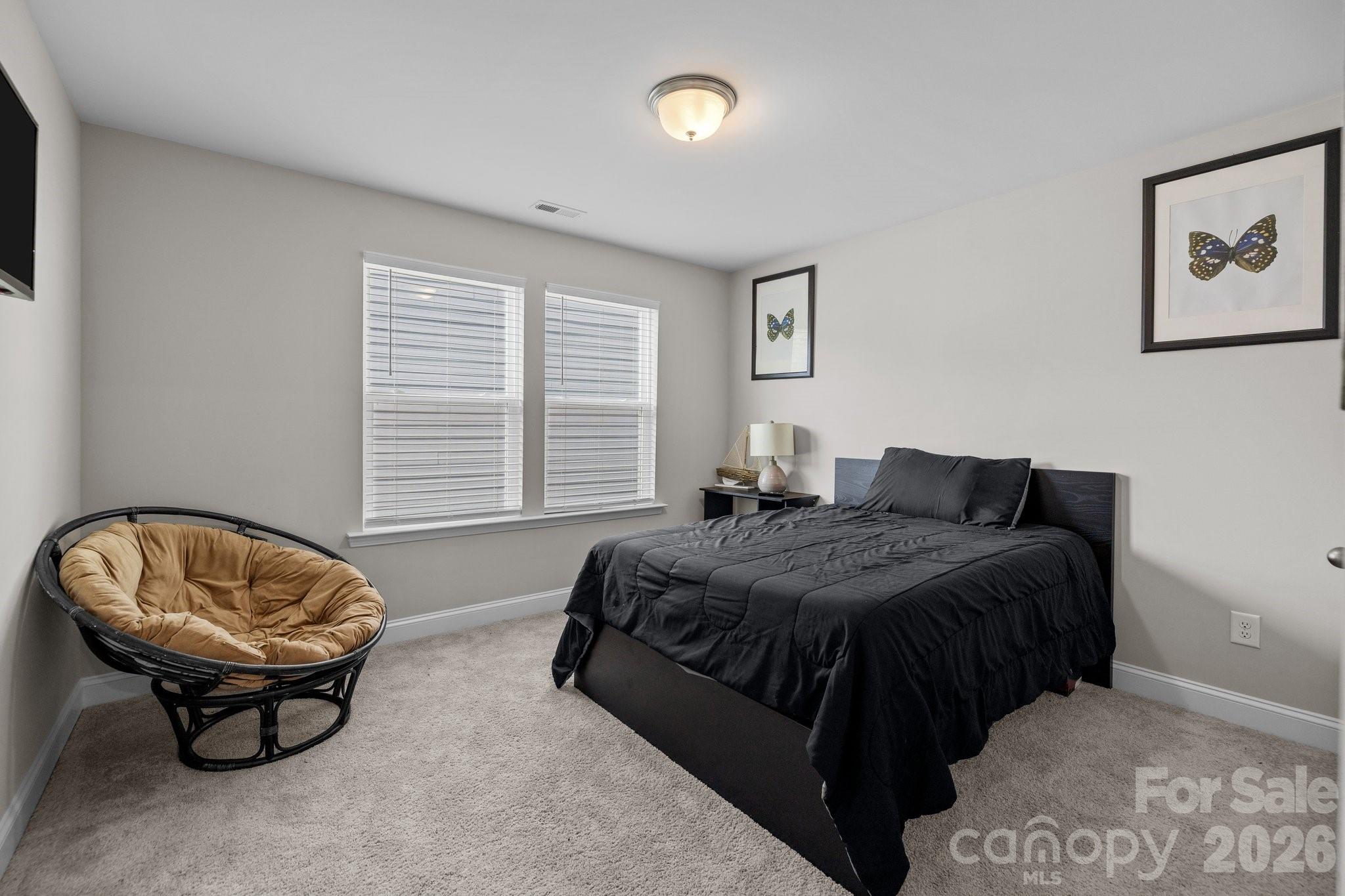 241 Boxelder Road Clover, SC 29710 - Photo 27 of 35 a spacious bedroom with a bed and a window