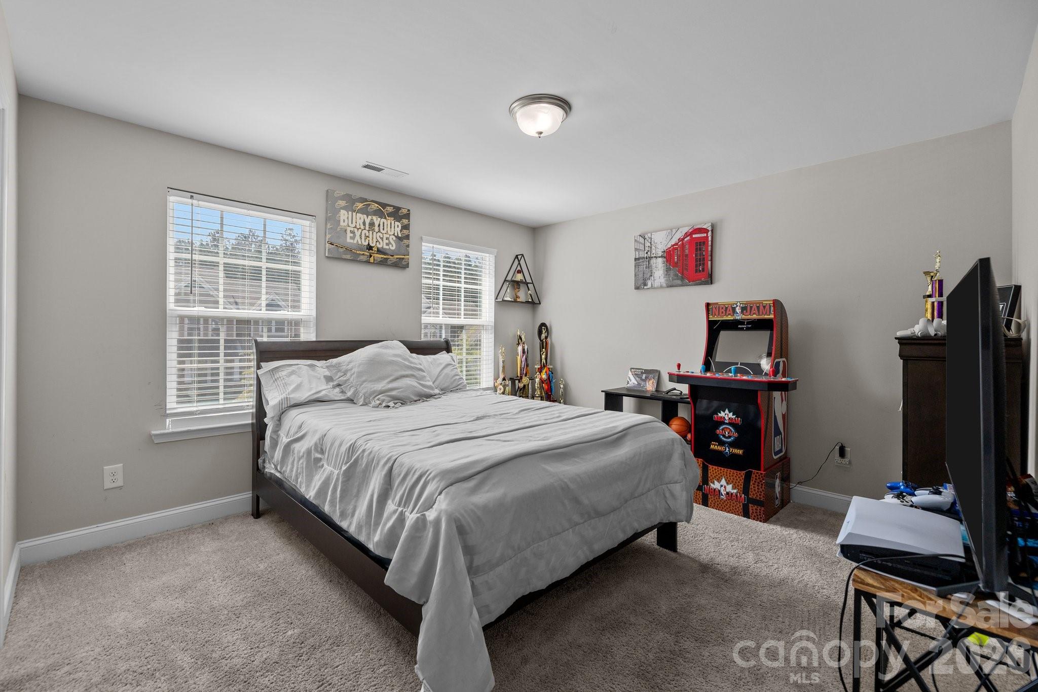 241 Boxelder Road Clover, SC 29710 - Photo 29 of 35 a bedroom with a bed and a flat screen tv