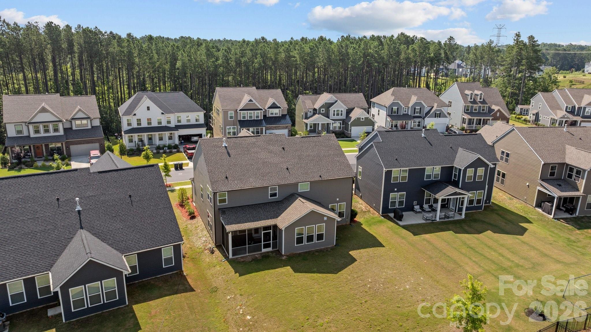 241 Boxelder Road Clover, SC 29710 - Photo 34 of 35 a view of a house with wooden deck patio and outdoor seating