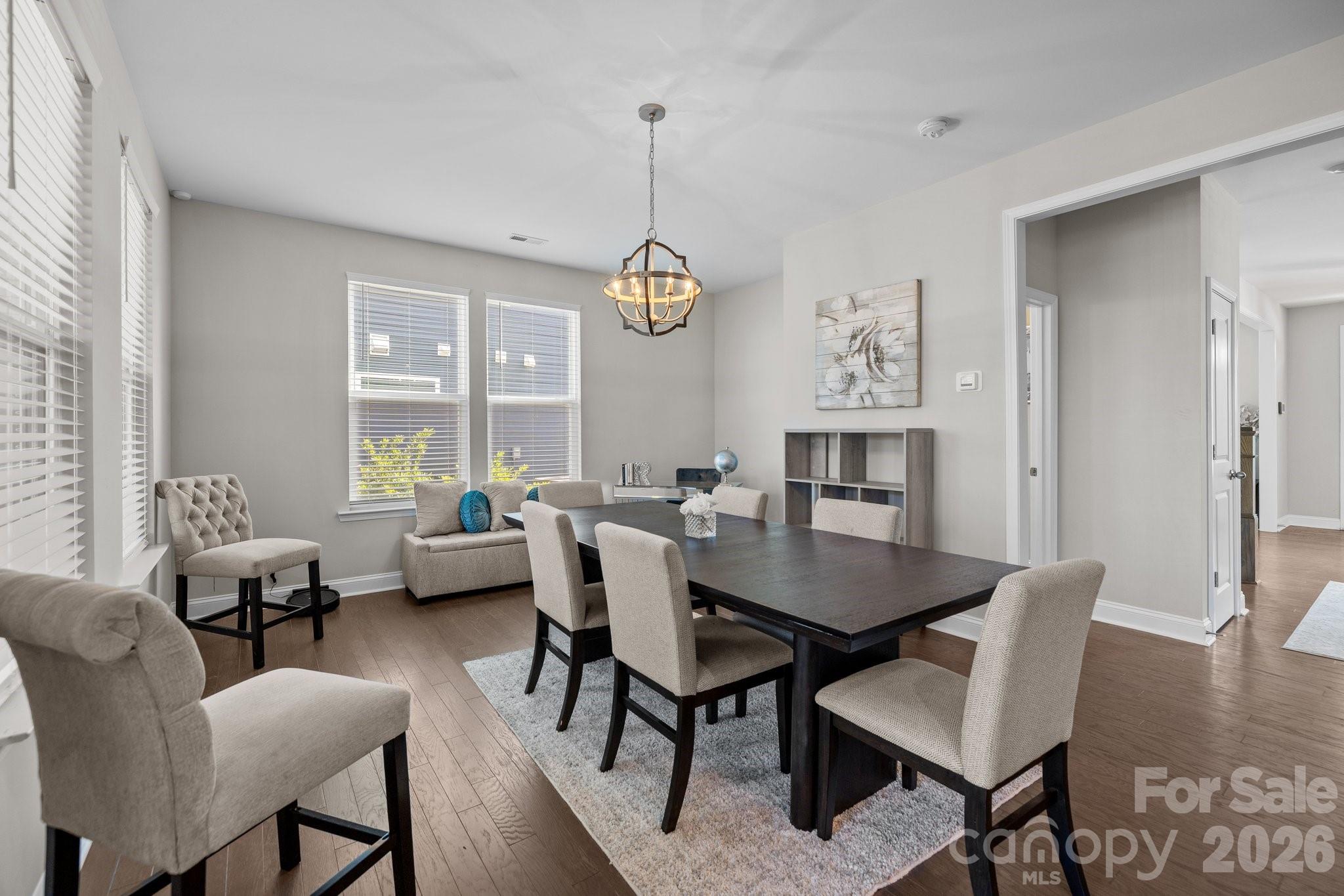 241 Boxelder Road Clover, SC 29710 - Photo 7 of 35 a dining room with furniture a chandelier and wooden floor