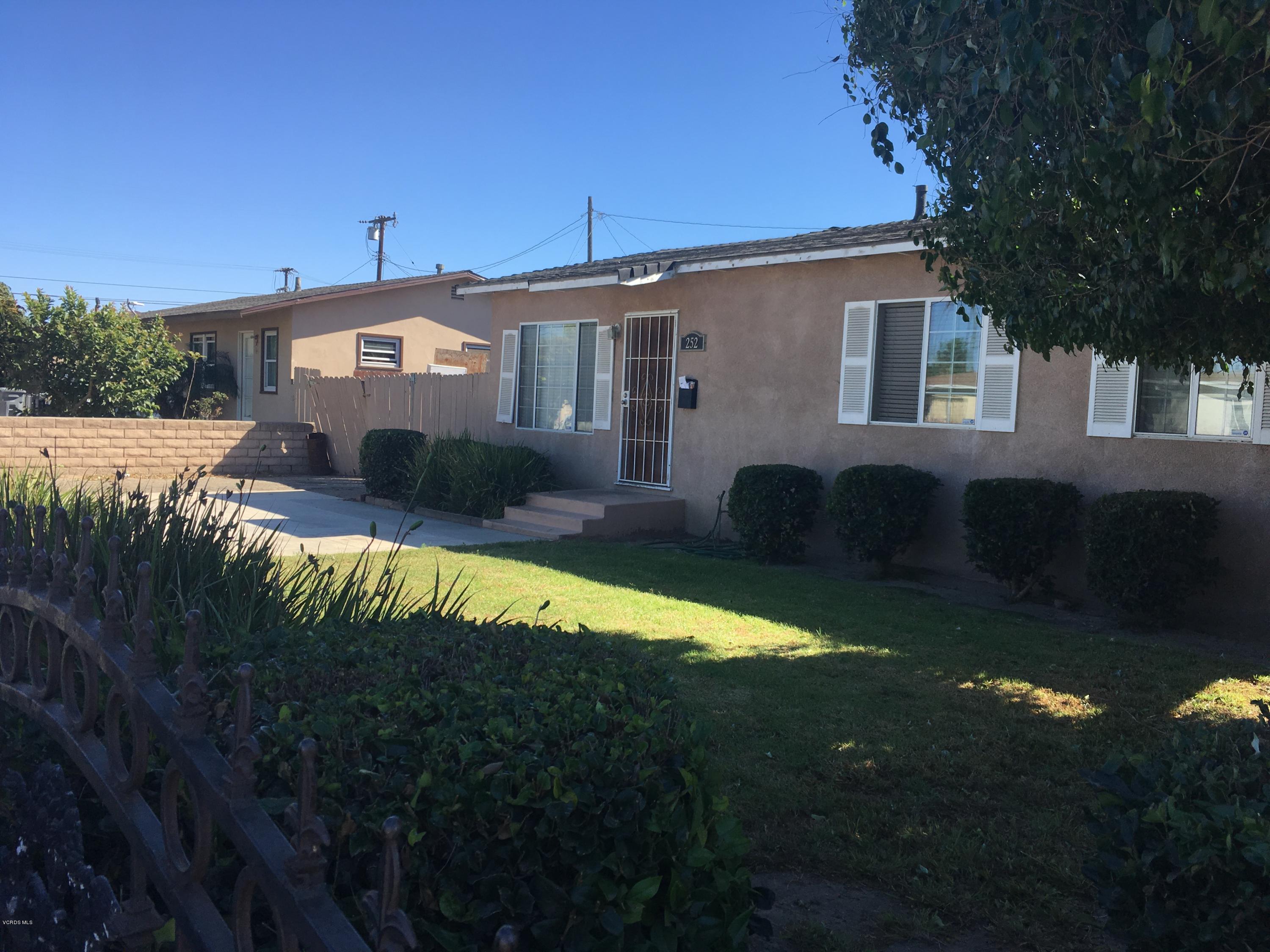 a view of a house with swimming pool yard and sitting area