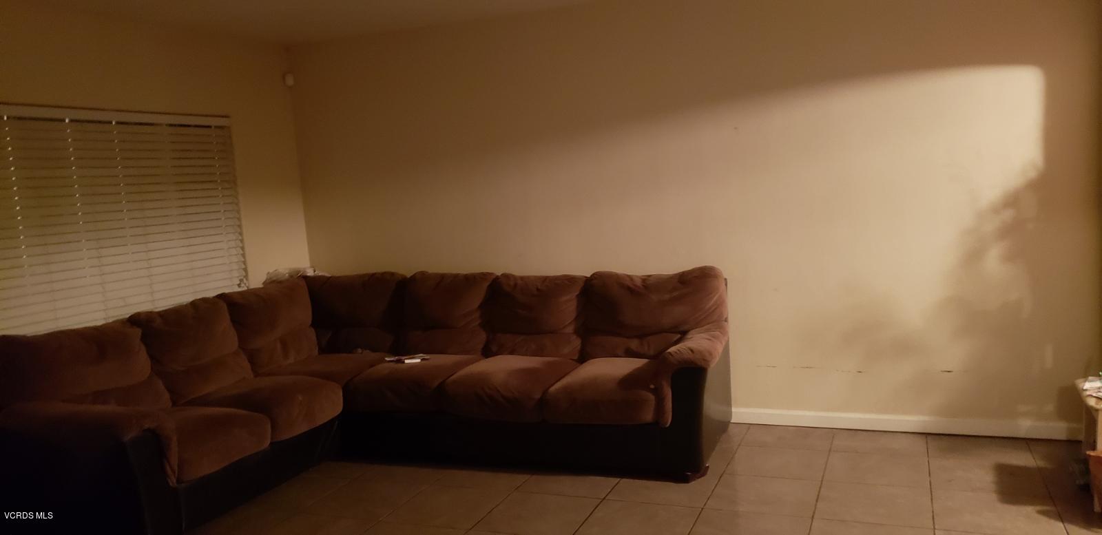 252 Smith Street Oxnard, CA 93033 - Photo 11 of 19 a living room with a couch