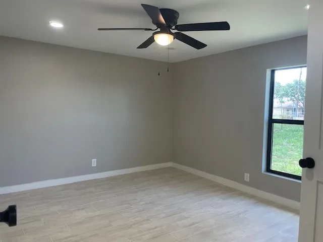 a bathroom with a shower and toilet