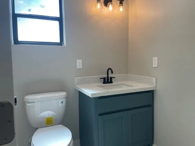 a view of a garage with a tree