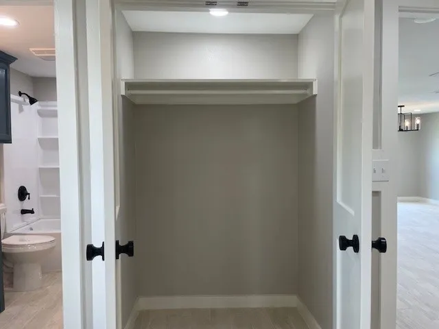 a bathroom with a bathtub and toilet