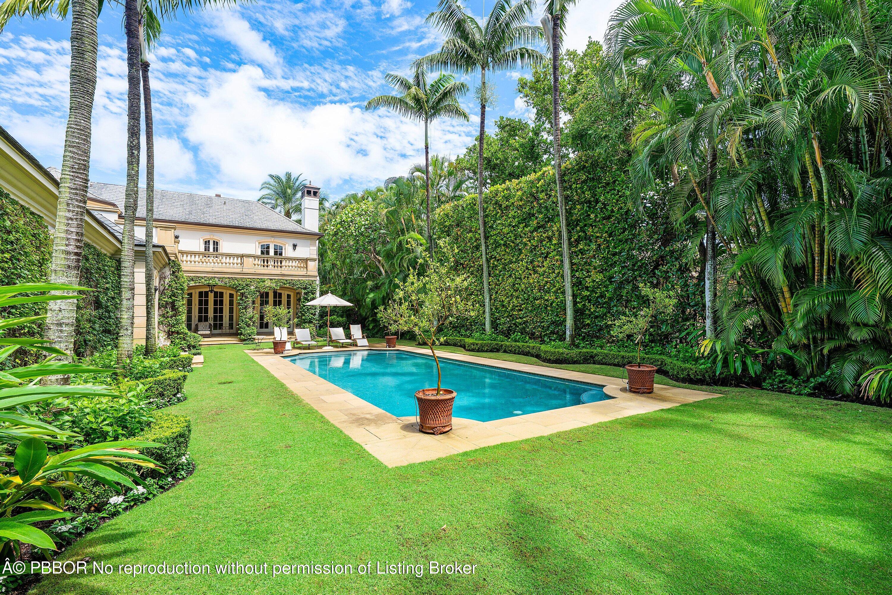 242 Wells Road Palm Beach, FL 33480 - Photo 36 of 54 a view of an house with swimming pool