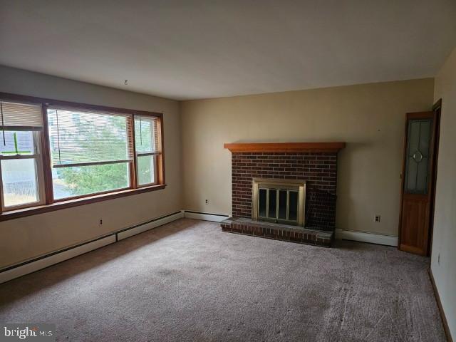 1836 3rd Street Langhorne, PA 19047 - Photo 3 of 14 an empty room with a fireplace and window