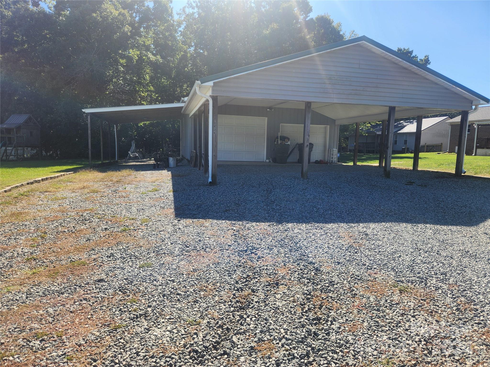 338 Helmstetler Road Lexington, NC 27295 - Photo 2 of 38 a view of a house with backyard and sitting area