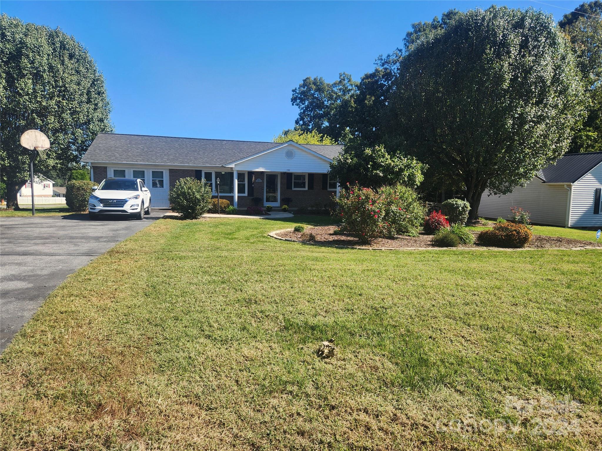 338 Helmstetler Road Lexington, NC 27295 - Photo 34 of 38 a view of a house with a yard and sitting area
