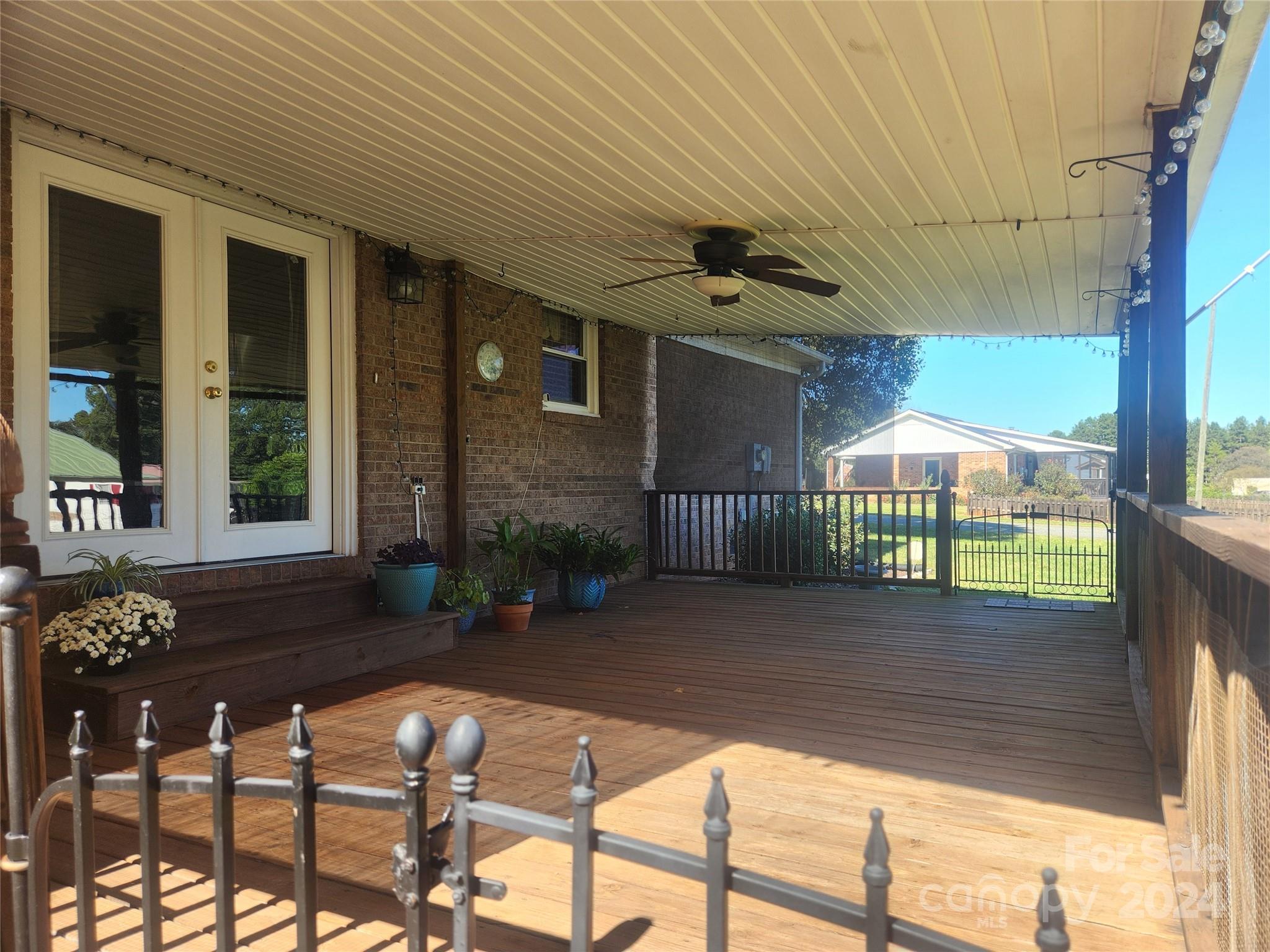 338 Helmstetler Road Lexington, NC 27295 - Photo 4 of 38 a view of a porch with furniture and floor to ceiling window