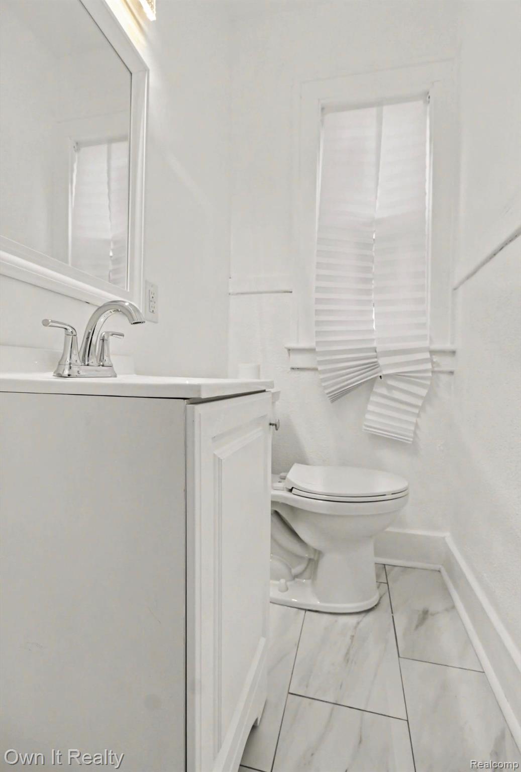 6023 Wayne Road Romulus, MI 48174 - Photo 15 of 25 Half bathroom with vanity and toilet