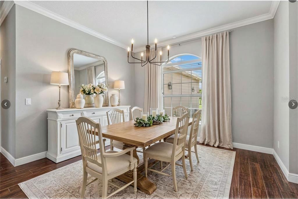 2350 Virgil Hall Road Lithia, FL 33547 - Photo 14 of 52 a view of a dining room with furniture window and wooden floor