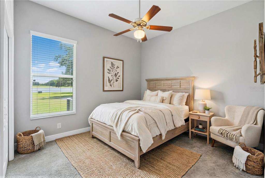 2350 Virgil Hall Road Lithia, FL 33547 - Photo 19 of 52 a bedroom with a bed and a couch