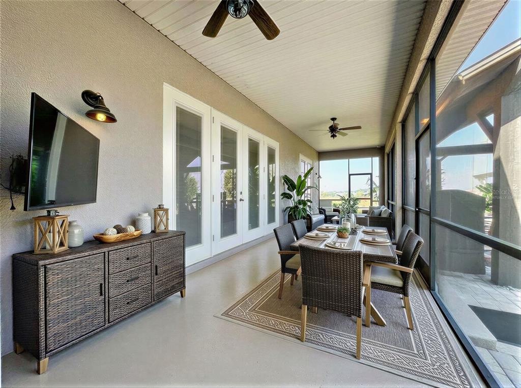 2350 Virgil Hall Road Lithia, FL 33547 - Photo 26 of 52 a living room with furniture and a flat screen tv