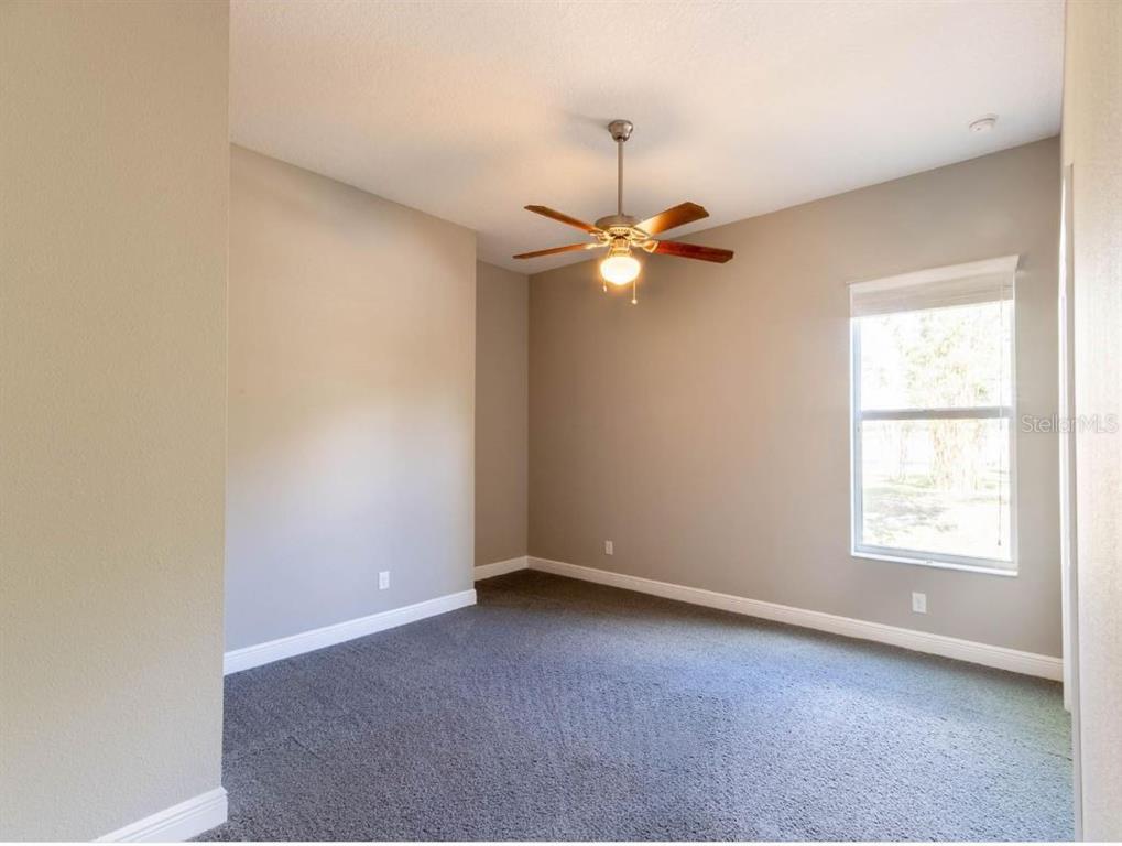 2350 Virgil Hall Road Lithia, FL 33547 - Photo 40 of 52 an empty room with a window and a fan